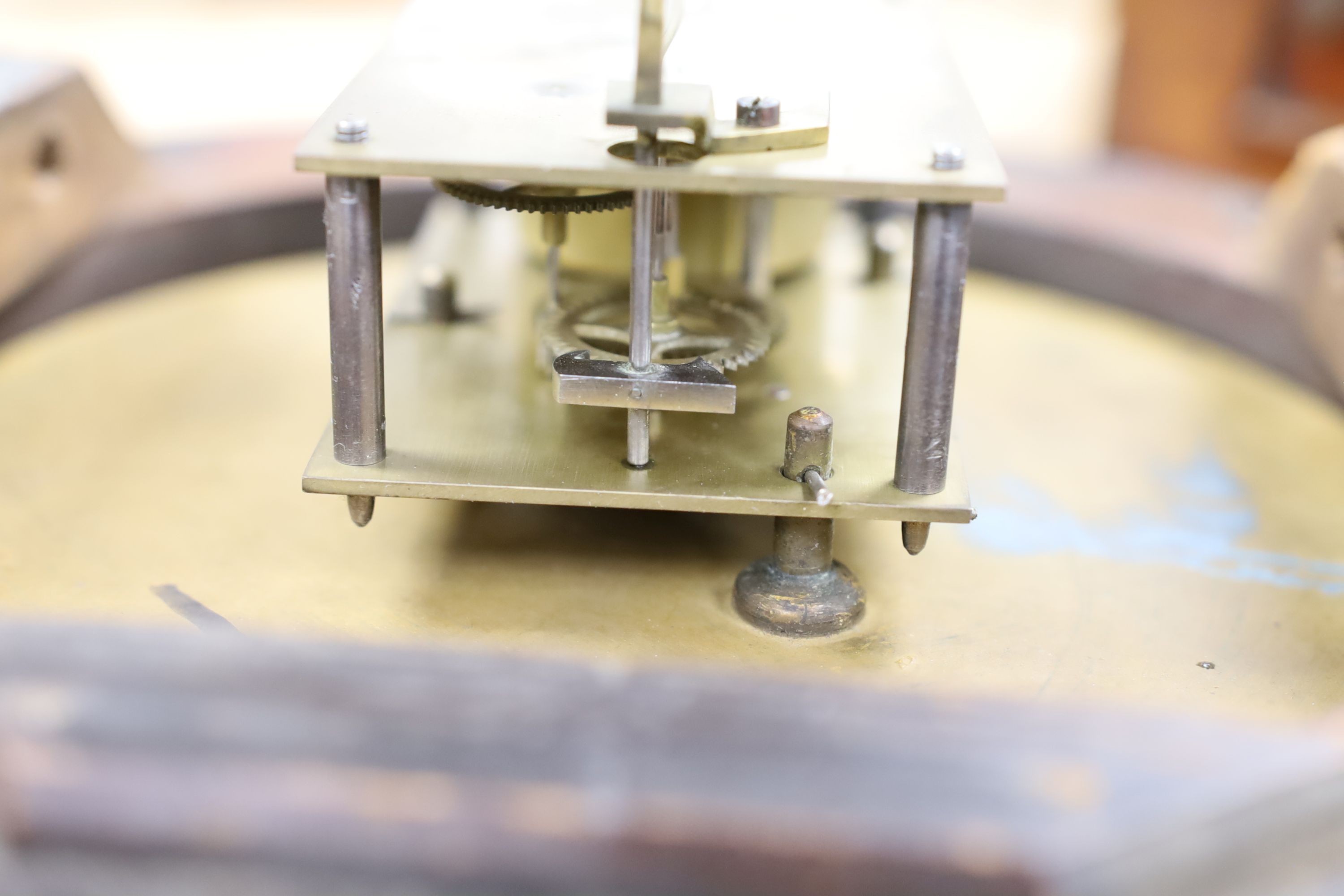 A Camera Kuss & Co. mahogany dial clock, 30 cms diameter.